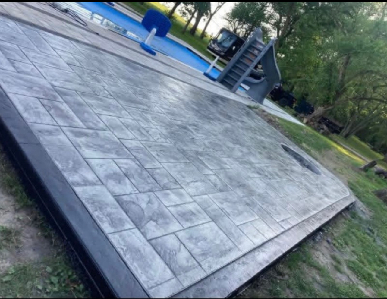 Gray stamped concrete pool deck