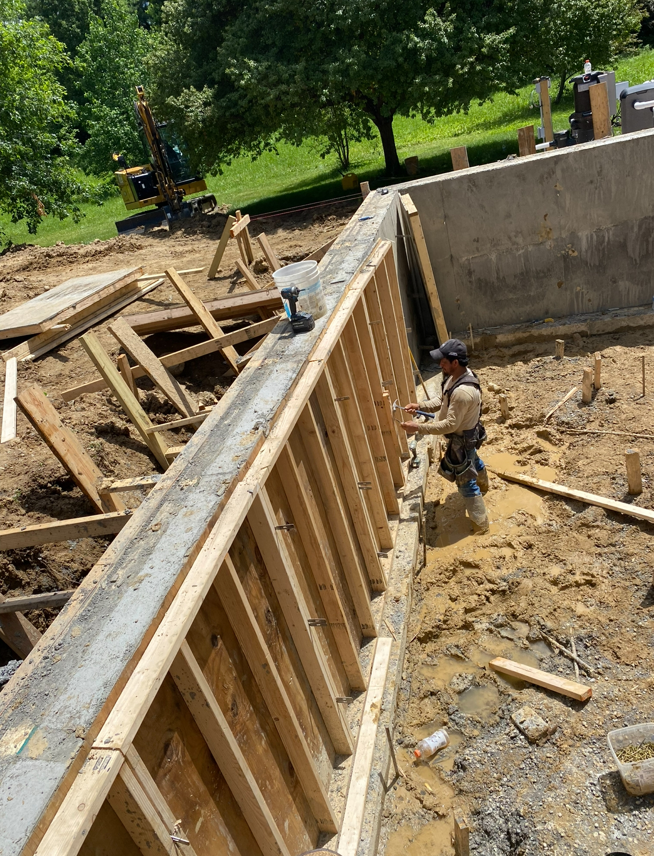 Foundation wall forms being poured on site